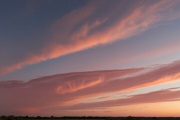 Obraz premium Blush and Apricot Cloudscape in Vibrant Morning Sky at Sunset