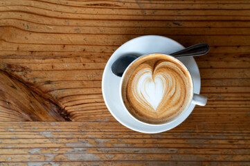 cup of cappuccino with heart latte art drawing