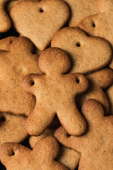 Festive gingerbread cookies on black background