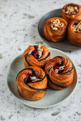 Cruffins with cherry filling and salted caramel on a plate