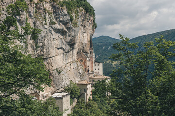 Church of Our Lady of the Madonna built on the slopes of a rocky mountain in northern Italy