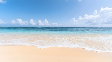 Fototapeta premium A serene beach scene with gentle waves lapping at the shore, soft golden sand, and a clear blue sky,No blurriness