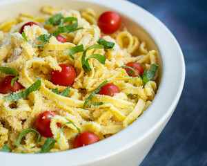 fettucine pasta bowl with tomatoes