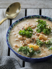 Bowl of soup on rustic table.