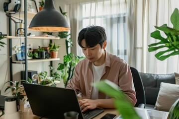 Asian Officer man while working from home. Ready for working with home office setup, comfortable to work everywhere with hi spreed internet.