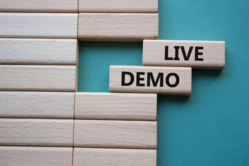 Live Demo symbol. Concept word Live Demo on wooden blocks. Beautiful grey green background....
