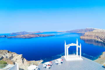 cafe table with caldera view, wedding arch, Santorini's beautiful details
