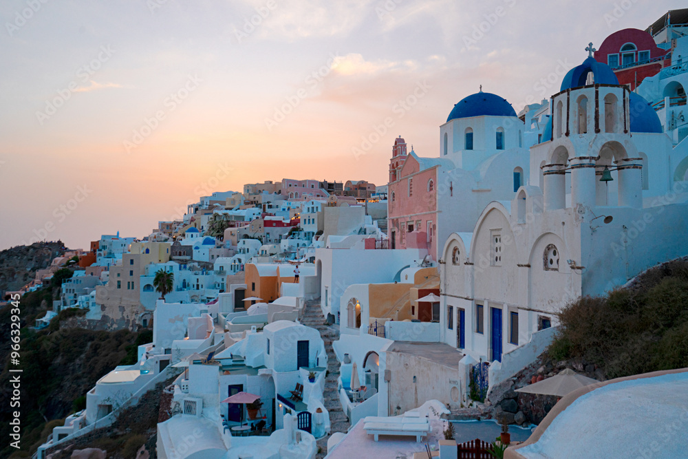 Sticker sunset over traditional Oia village, Santorini island with Aegan sea, Greece