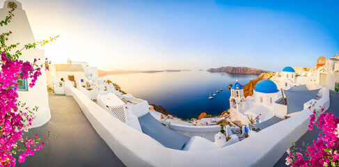 traditional greek village Oia of Santorini, with blue domes against Aegan sea and caldera, Greece, web banner format, toned