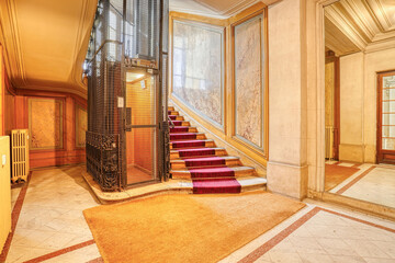 staircase in a hotel witj old elevator © laurent h. mercier