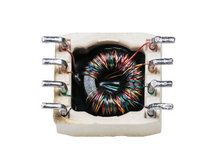 Toroidal transformer with colored wire on ferrite core isolated on white background. Closeup of...