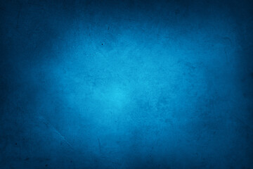 Blue textured concrete wall background. Dark edges