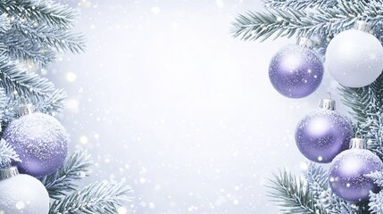 Festive winter holiday decoration with purple and white ornaments on snow-covered evergreen branches