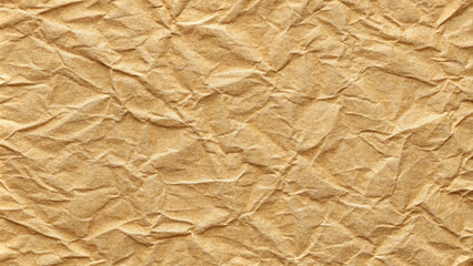 Obraz premium Crumpled brown paper texture, warm earthy tones, rustic background for creative projects