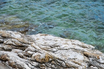 Rocky shoreline with clear turquoise water