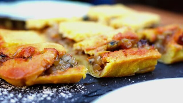 Empanada de millo de zamburi&ntilde;as (Galician queen scallop empanada made with corn dough) at restaurant in Vigo, Spain