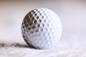 Close-Up of a Golf Ball on a White Background. Sports Equipment Detail