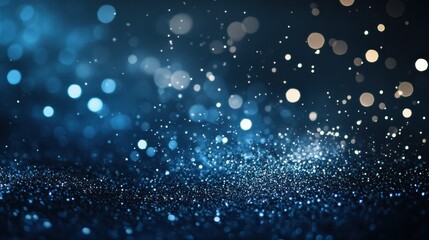 Scattered gradient blue to silver particles against a dark backdrop create a cool, sophisticated design element