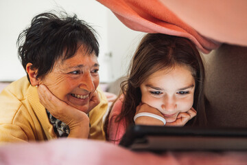 Grandmother and Granddaughter Enjoying Tablet Time