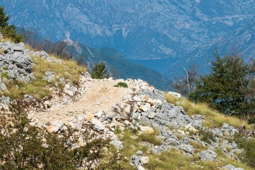 Rocky mountain path with distant valley view. Montenegro