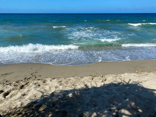 Waves and sand on the beach