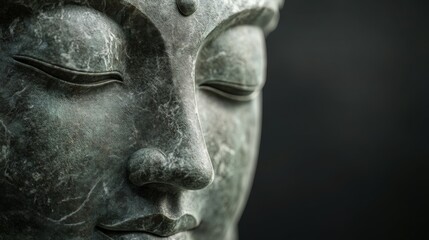 Buddha sculpture carved from marble highlighting serene facial features
