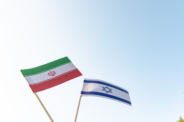 Flags of Israel and Iran, conflict between countries.