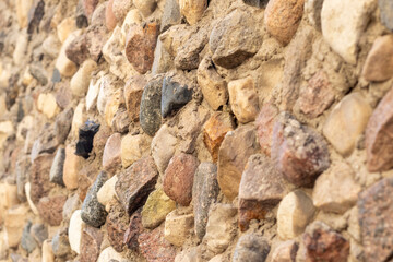 Concept shot of the rough wall made of stones. Surface