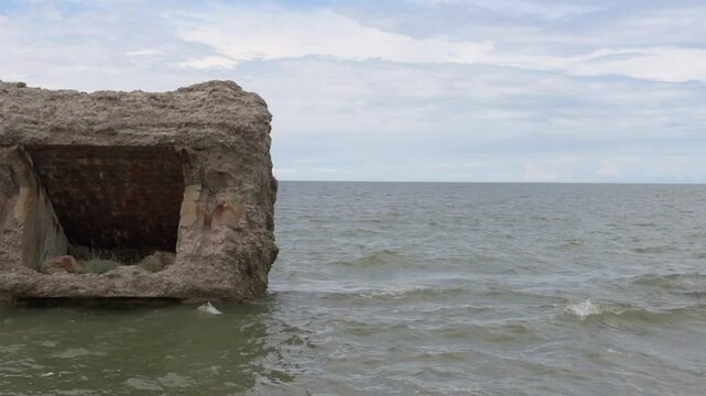 Ruins of an old abandoned military fort, bunkers on the Baltic Sea beach in Karosta Liepaja, Latvia. Part of an old fort in the former Soviet base.
