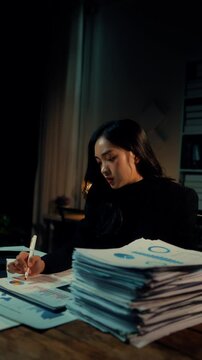 Accountant works late into the night, battling fatigue while managing a mountain of paperwork. Stress and pressure mount as deadlines loom, leading to frustration and exhaustion