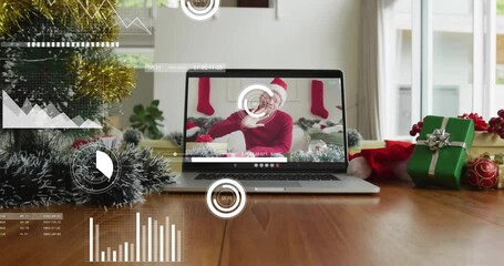 Animation of data processing over albino african american man having christmas video call - Powered by Adobe