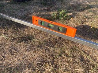 Installation of a metal frame greenhouse with polycarbonate covering