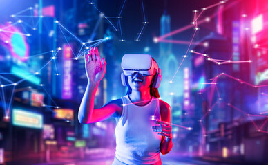 Fototapeta premium Female standing in cyberpunk style building in meta wear VR headset connecting metaverse, future cyberspace community technology, Woman trying touching virtual reality object with hand. Hallucination.