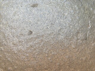 The process of mixing cement and sand for concreting