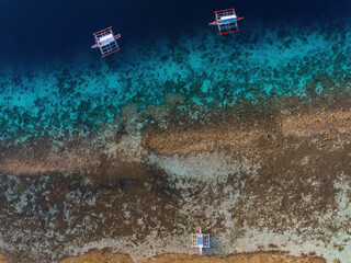 Topdown aerial photograph of bangka boats at the reef in Moalboal, Cebu, Philippines  © andriislonchak