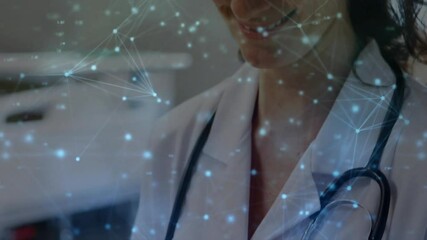 Animation of network of connections over caucasian female doctor using tablet - Powered by Adobe