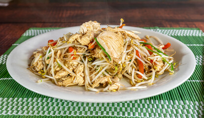 chifa, noodles with chunks of chicken and vegetables. peruvian food