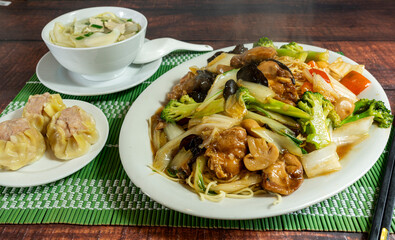 chinese noodles with vegetables, meat and mushrooms, chifa, peruvian food