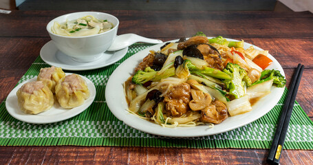 chinese noodles with vegetables, meat and mushrooms, chifa, peruvian food