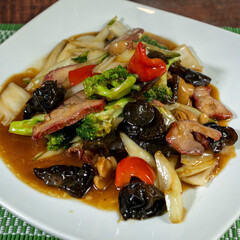 Beef tausi with vegetables, chifa, peruvian food, close-up