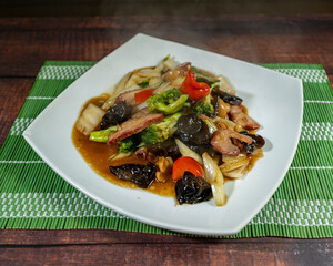 Beef tausi with vegetables, chifa, peruvian food, close-up