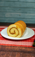 pionono, bolu gulung. filled with blancmange