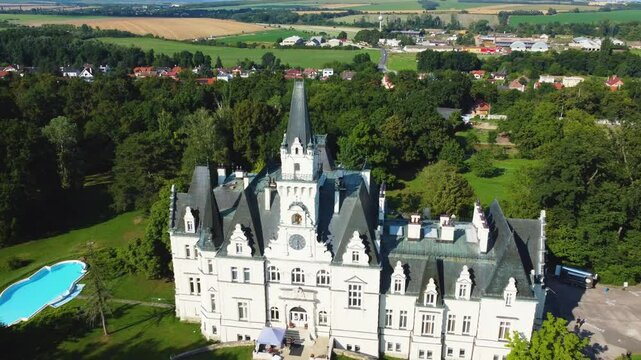Stunning 4K drone footage of Budmerice Castle in Slovakia. Discover breathtaking aerial views of this picturesque 19th-century castle surrounded by lush greenery and beautiful gardens