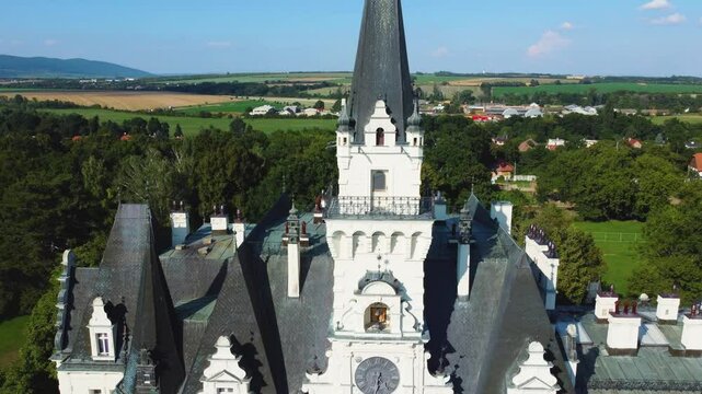Stunning 4K drone footage of Budmerice Castle in Slovakia. Discover breathtaking aerial views of this picturesque 19th-century castle surrounded by lush greenery and beautiful gardens