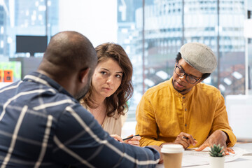 Entrepreneur evaluating office building potential before reaching an agreement, working with...