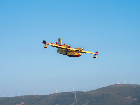 Ponferrada, Leon, Spain; 08-19-2024: Canadair CL-215 amphibious seaplane from the 43rd Air Force Group of the Spanish Air Force preparing for the maneuver to collect water from the Barcena reservoir