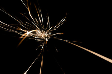 sparks from the grinder glowing in the dark