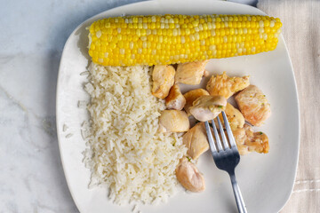 chicken bites  with rice and corn