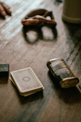 Antique cigarette case, deck of cards and pretzel in an old German restaurant