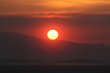 Golden Dusk Beneath a Cloudy Sky